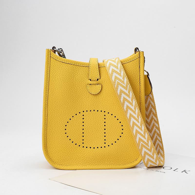 Factory wholesale first layer togo cowhide bucket bag women's bag lychee pattern hollow single shoulder crossbody bag hollow design