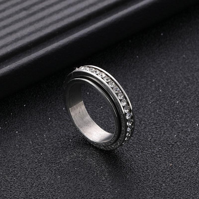 Anillo de pareja de acero inoxidable giratorio con diamantes de dos colores, sencillo, de moda, de titanio y acero, para parejas