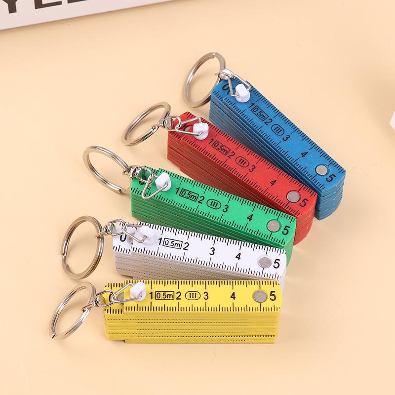 1 Stück 0,5 Meter 10-fach Schlüsselanhänger Kunststoff Hochpräzisions-Faltmaßstab Kann für Reisen, Holzbearbeitung, Maurerarbeiten, Heimwerken aufbewahrt werden