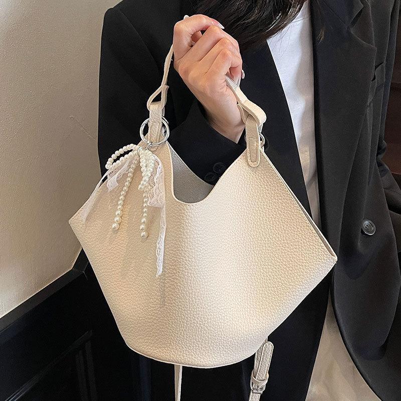 This year, the Korean version of the simple lychee pattern portable mother and child bag is popular, high-end, lightweight and versatile fashion mess