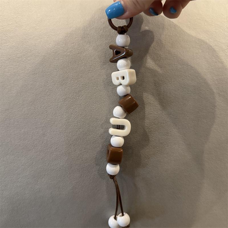 Customizable personality trend creative letter knot handwoven fashion nylon car keychain mobile phone cord