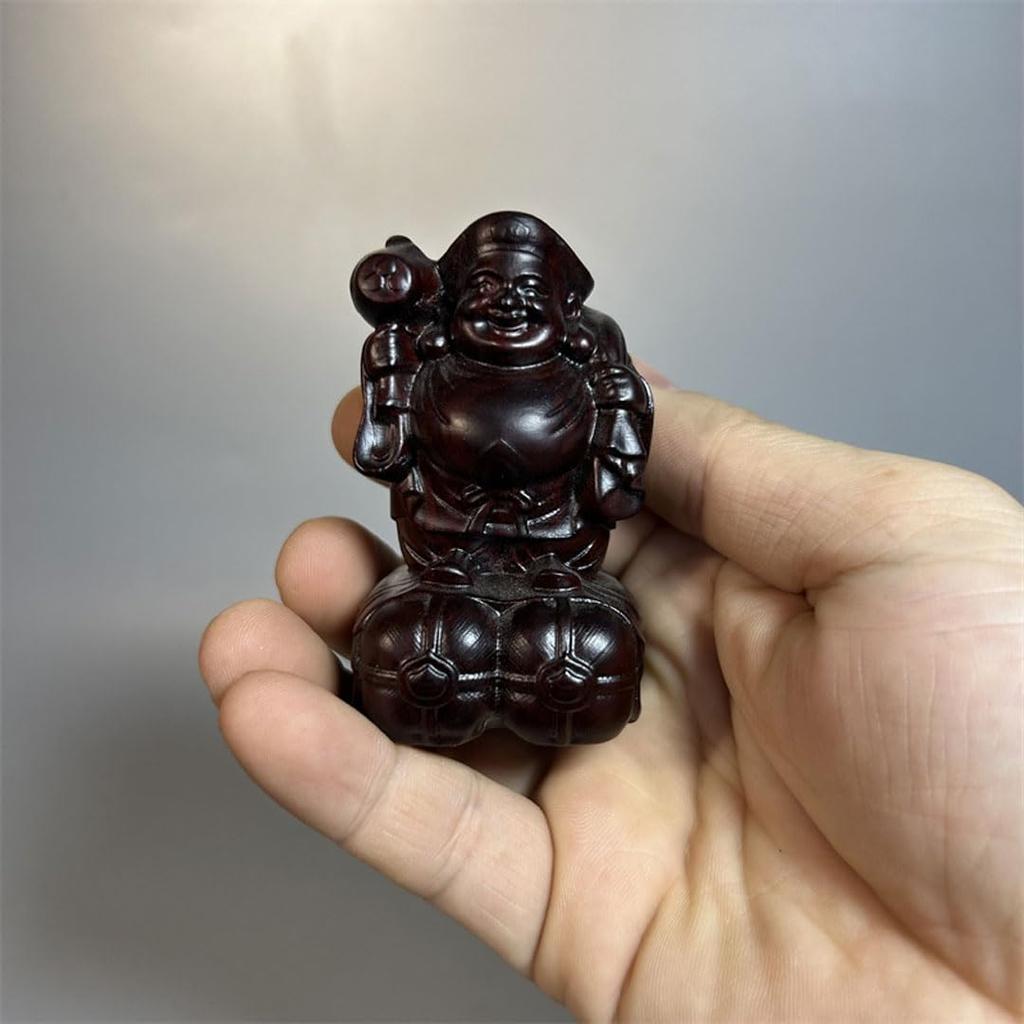 Daikokuten, einer der Sieben Glücksgötter, ist eine Holzfigur von Daikokuten, gefertigt aus Ebenholz. Diese Holzstatue ist ein Talisman für geschäftlichen Wohlstand,