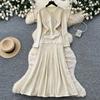 Pink knitted dress women's long-sleeved A-shaped skirt high waist and thin commuter temperament skirt small fragrant style long skirt