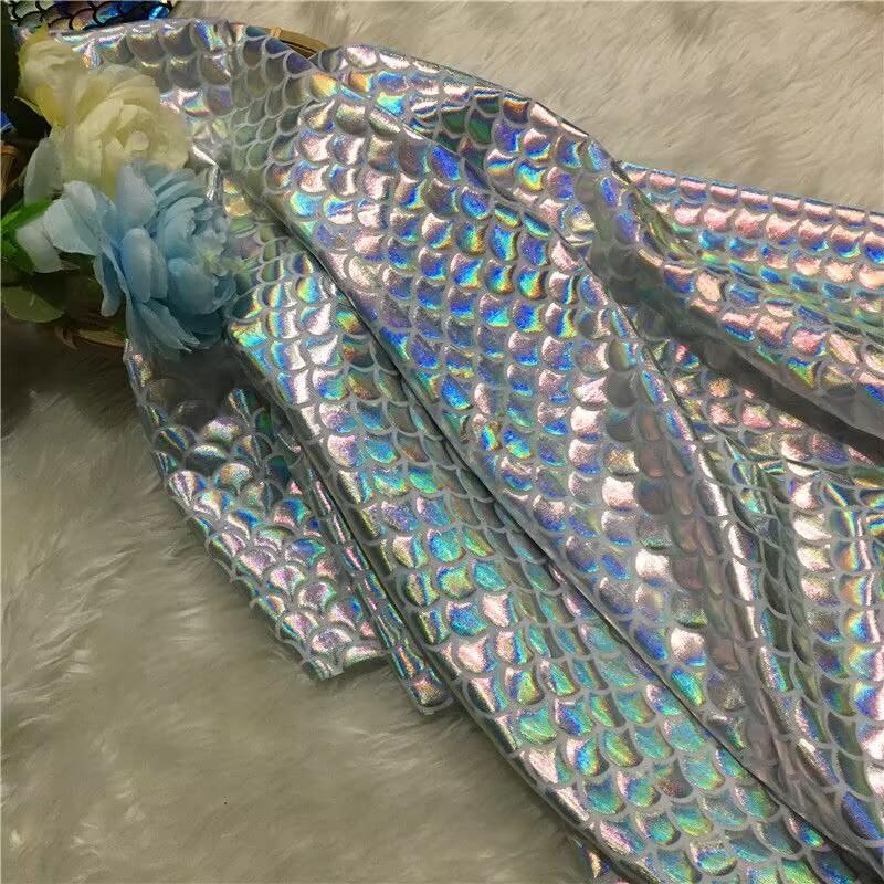 

Ткань с чешуей русалки Радужный цвет Голограмма Двусторонняя эластичная Ткань с рыбьей чешуей Блестящий спандекс С принтом русалки Рыба 150X100cm 1lot