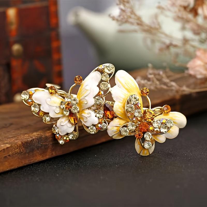 

The ethnic style hairpin, crafted with enamel technique and equipped with a spring mechanism, is suitable for adults to use жовтий