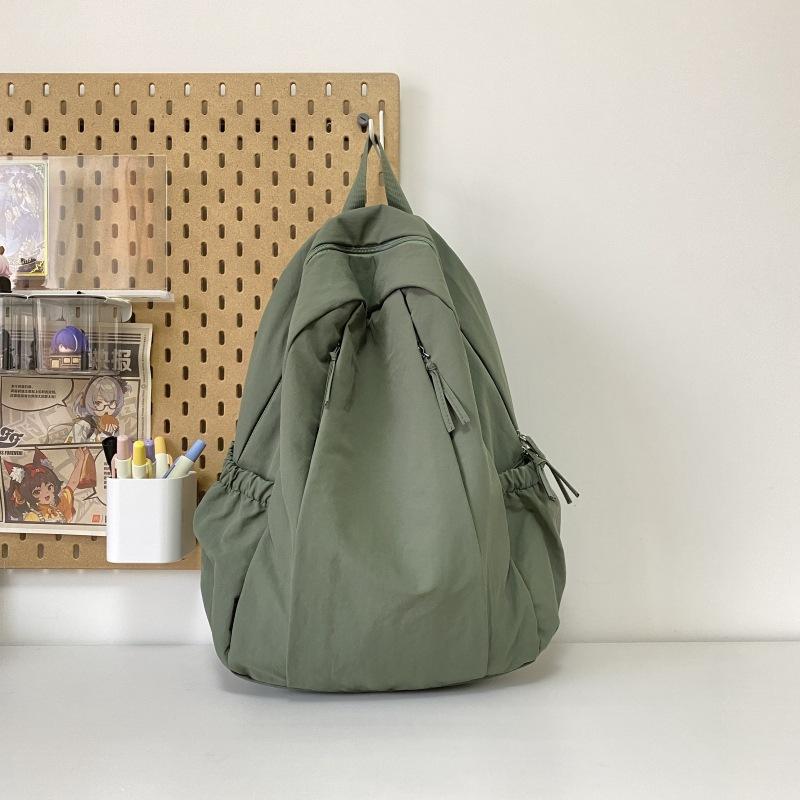 Travel lightweight advanced sense niche backpack college student commuter junior high school girls schoolbag Japanese and Korean simple backpack