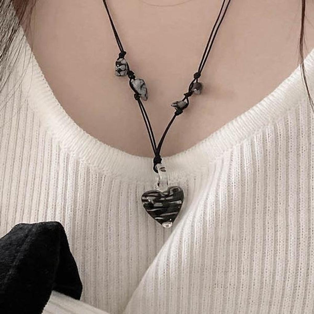 Vintage achromatic knotted glass heart necklace