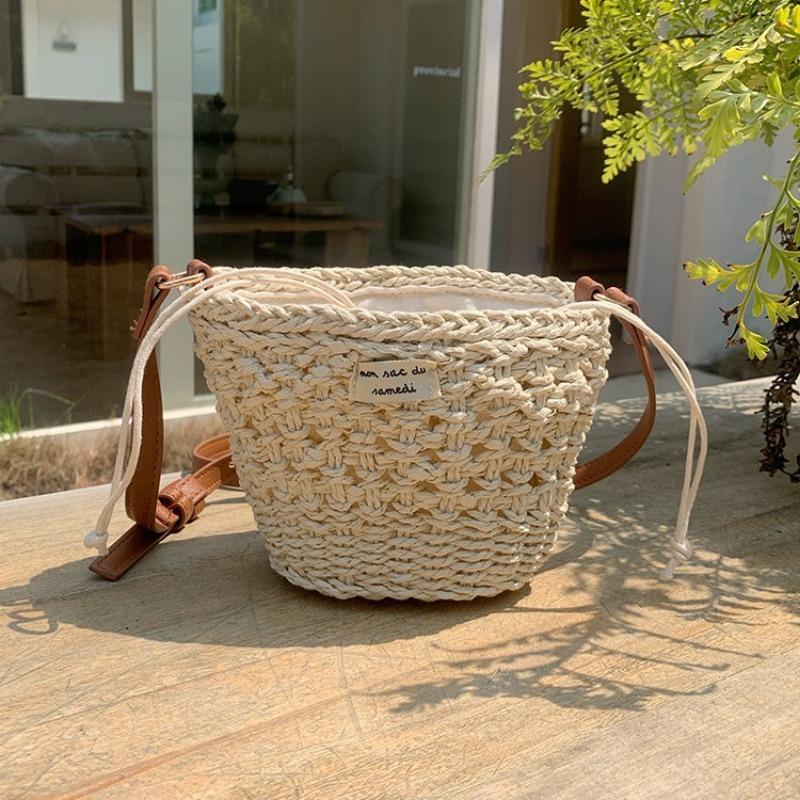 Niche woven bag women's summer new leisure vacation style straw woven bag beach bag mini portable shoulder messenger bag
