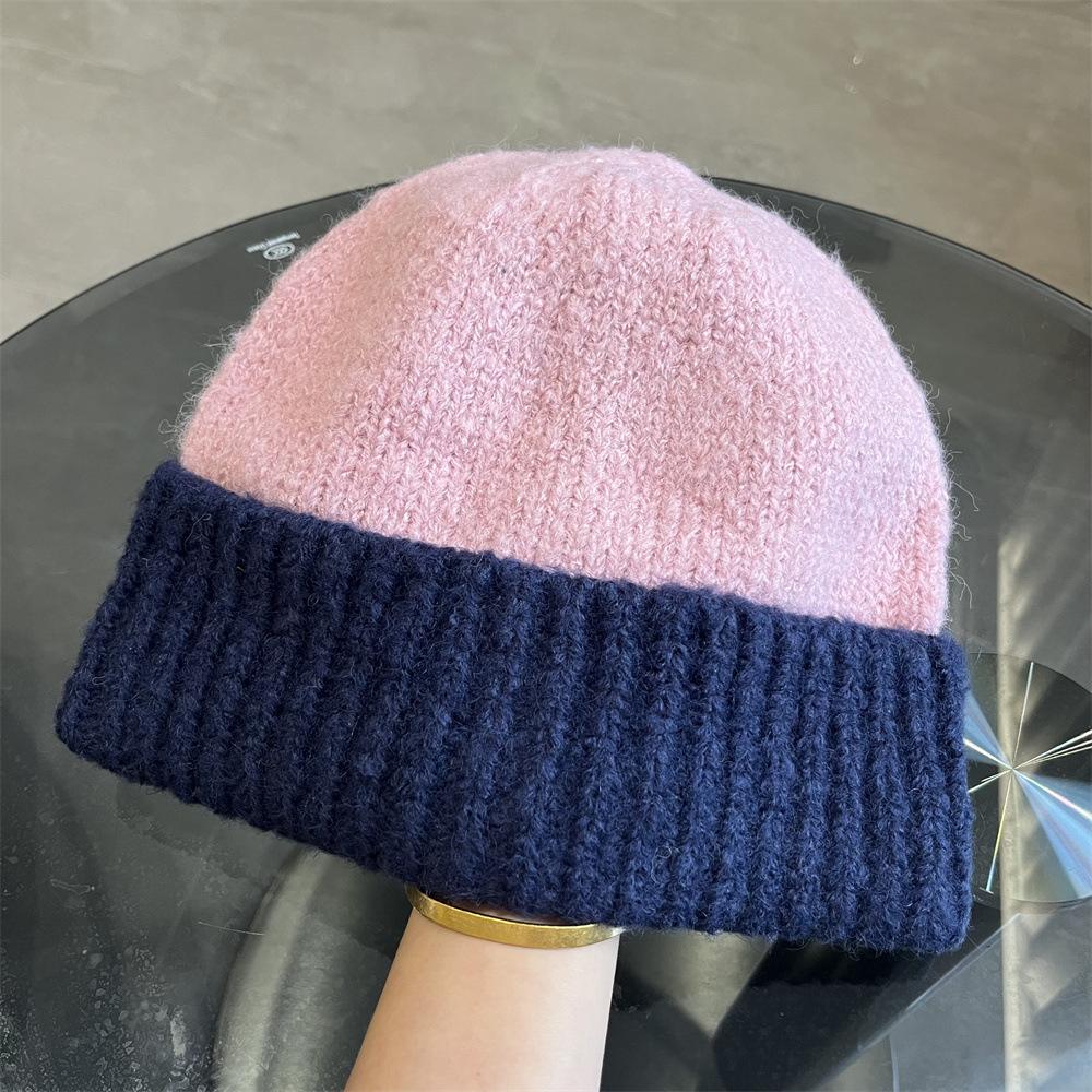 Simple two-color splicing wool hat women's autumn and winter warm niche versatile ear protection hat large version knitted pullover hat tide