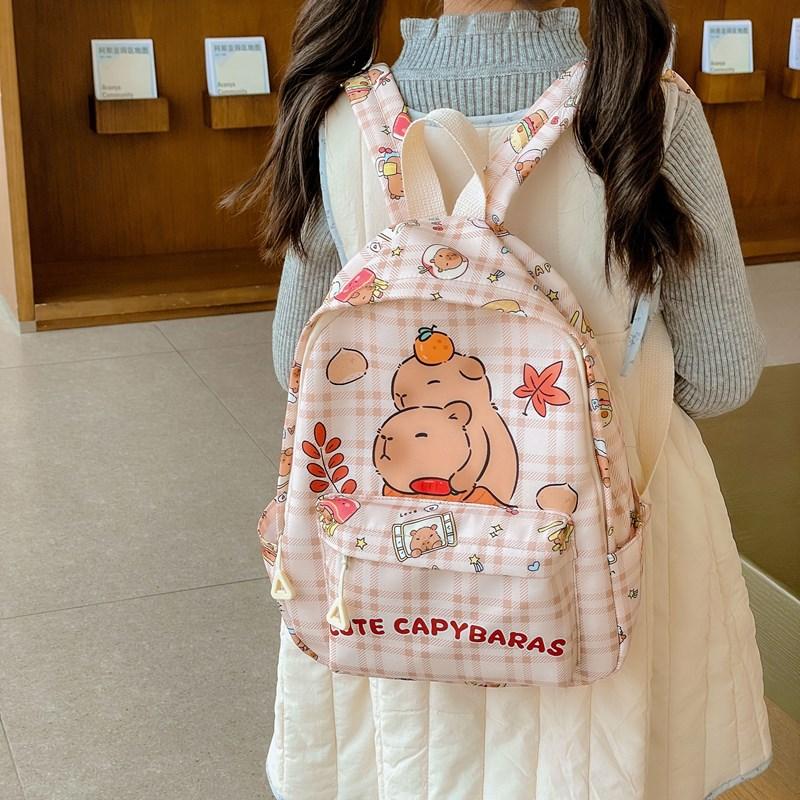 School BagsKapibara cartoon children's bag for boys and girls, casual and cute backpack, trendy and versatile .