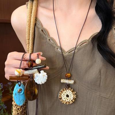 Retro Coffee Color Water Drop Flower Necklace - Light Luxury Chinese-Inspired Long Pendant for Women