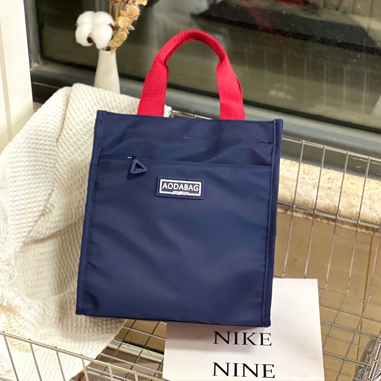 

The new Mori series contrasting color portable lunch box bag, student carrying bento bag at work, make-up bag, file bag, hand carrying mommy