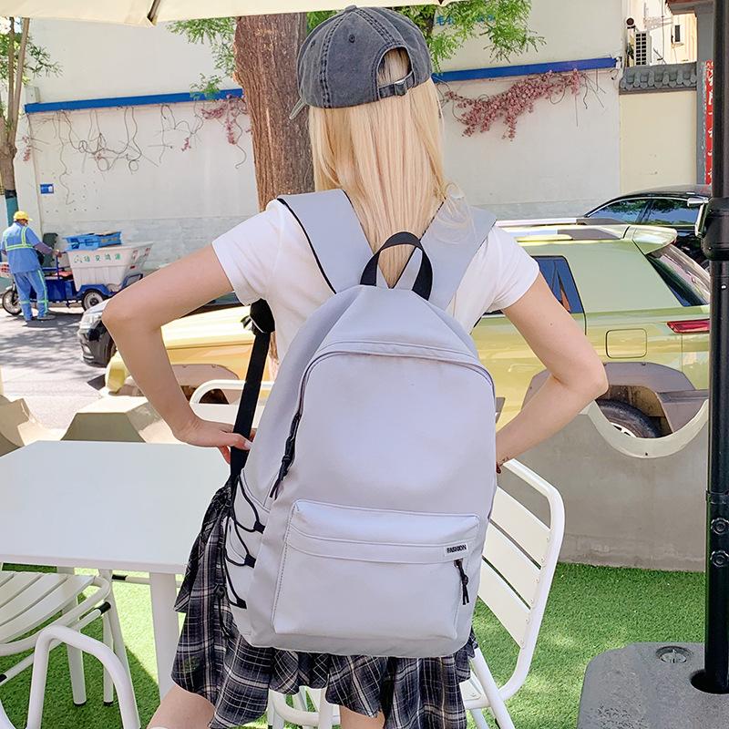 New junior high school primary school students schoolbag large capacity lightweight backpack girl simple leisure travel backpack tide
