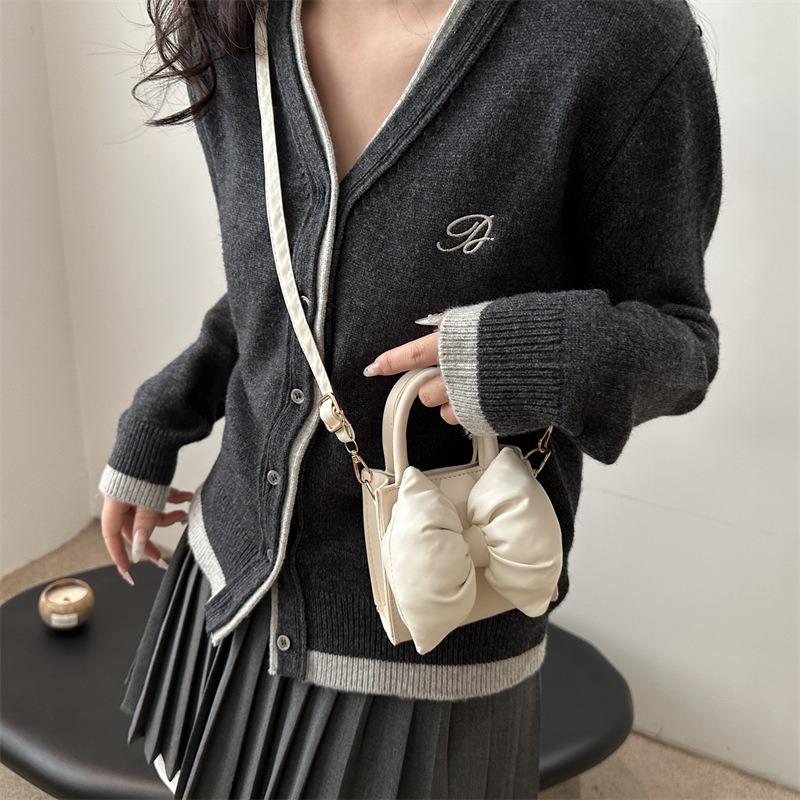 Niche bow solid color new mini hand carry small square bag summer beautiful retro shoulder messenger bag women