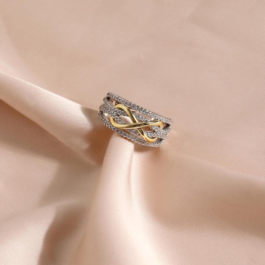 Dual-Tone Infinity Ring with Shimmering Diamonds: Gold & Silver Symbol of Eternity