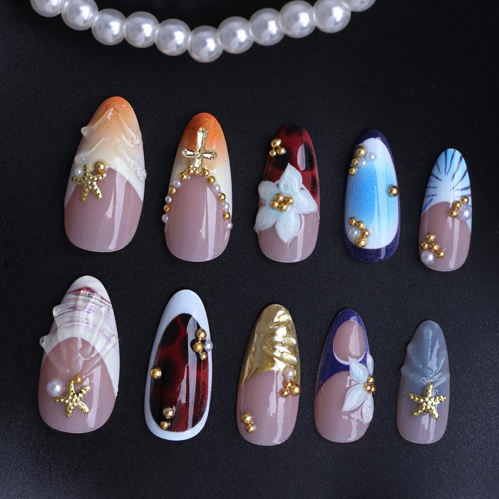 24-piece almond-shaped press-on nails in blue, white, milky white, and coffee color with hand-applied floral embellishments