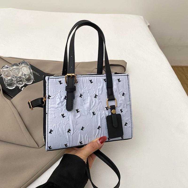 

Black pink contrasting color bow small bag women s 2025 summer new shoulder underarm bag fashionable and sweet hand bag синій