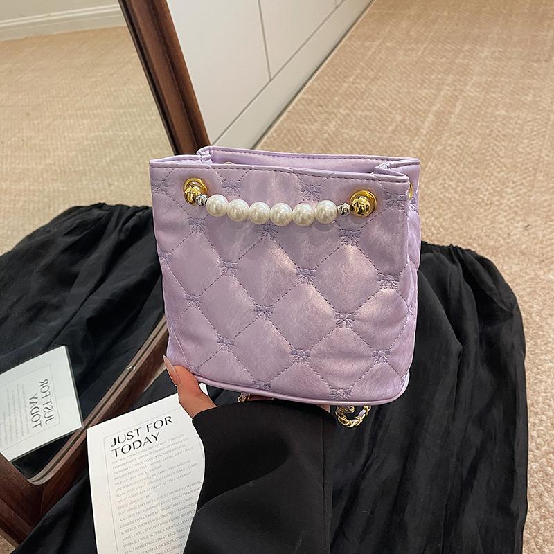 

Korean version of fashion diamond chain bag women s bag 2025 new simple bucket bag niche shoulder messenger bag фиолетовый