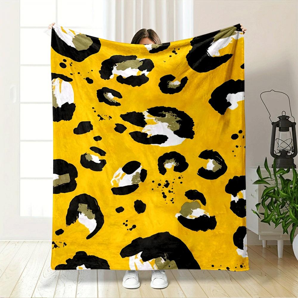 Abstract leopard print with black, white, and olive spots on yellow. for all seasons blanket lunch break throw gift