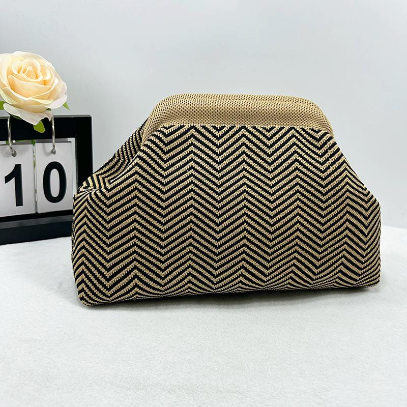 Knitted bag, striped clutch bag, women's flying woven clouds, versatile temperament, portable cosmetic bag, large capacity