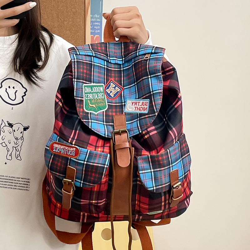 

2025 school season new student schoolbag Korean version fashionable contrasting color plaid large-capacity high school casual backpack