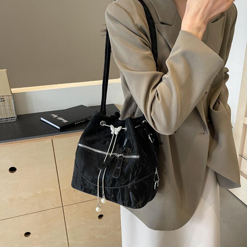 Silver bag women's 2025 new fashion backpack design sense school bag college student shoulder crossbody bucket bag