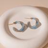 Vintage simple oil drop twisted C-shaped silver needle European and American commuter geometric earrings 