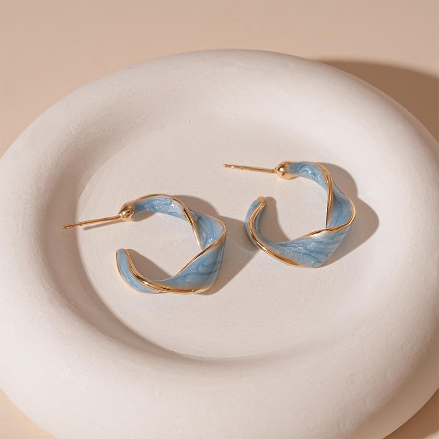 Vintage simple oil drop twisted C-shaped silver needle European and American commuter geometric earrings