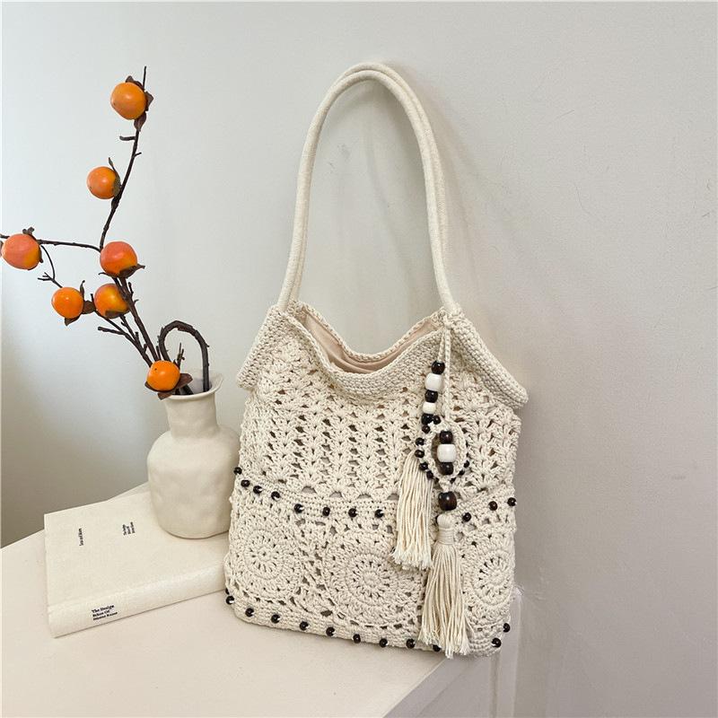 

New tassel cotton thread shoulder straw bag niche hollow woven bag casual underarm beach bag fashion bag women