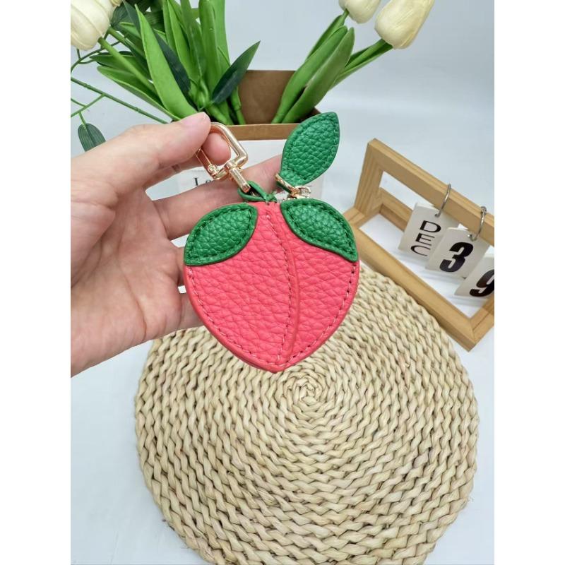Creative fruit change bag, small peach leather change bag, mini hanging keychain earphone bag.