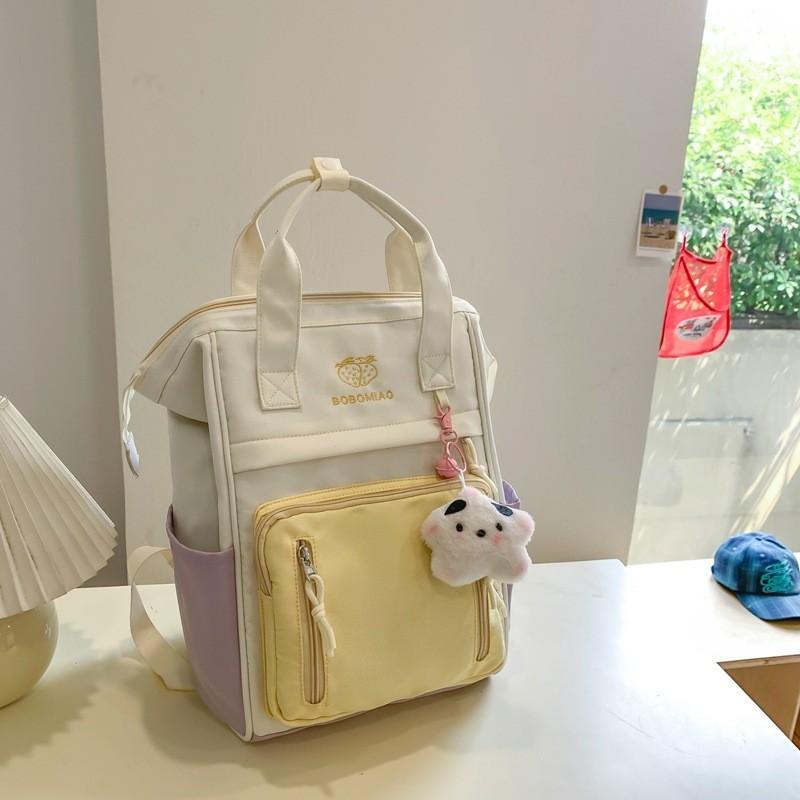Retro Japanese Style Color Block Backpack With Cartoon Design And Waterproof Nylon Material