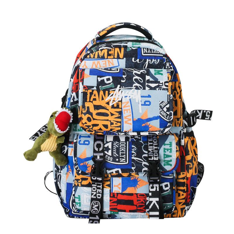 

School bag new fashion graffiti newspaper backpack couple large capacity nylon backpack синій