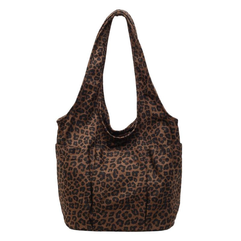 This season, Korean ins style leopard print canvas bag casual large capacity commuter women's shoulder underarm triangle tote bag