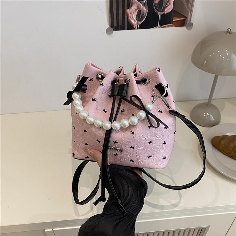 

Sweet bucket bag women s bag new summer bow portable shoulder bag literary and leisure commuter messenger bag