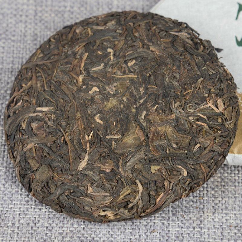 Yunnan Pu'er Tee Frühlingstee Roh Tee 100g Kuchentee Isländischer Roher Kuchentee