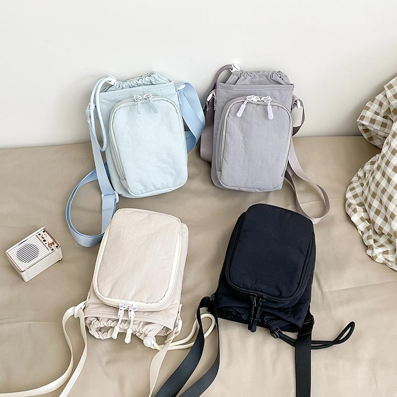 Crossbody bag women's new Korean version of simple solid color small square bag casual versatile mobile phone bag student water cup bag tide