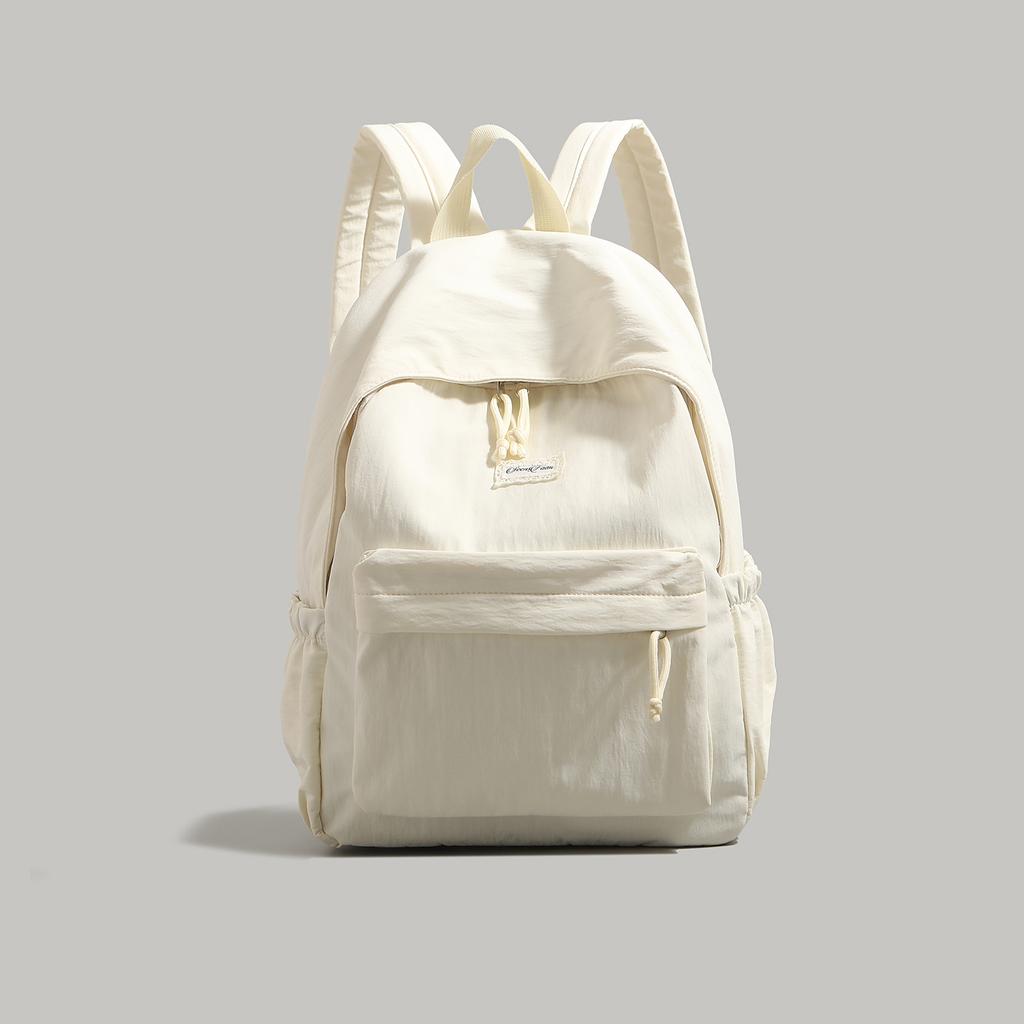 High-value solid-color backpack women's 2025 new college student schoolbag large-capacity lightweight short-distance travel backpack