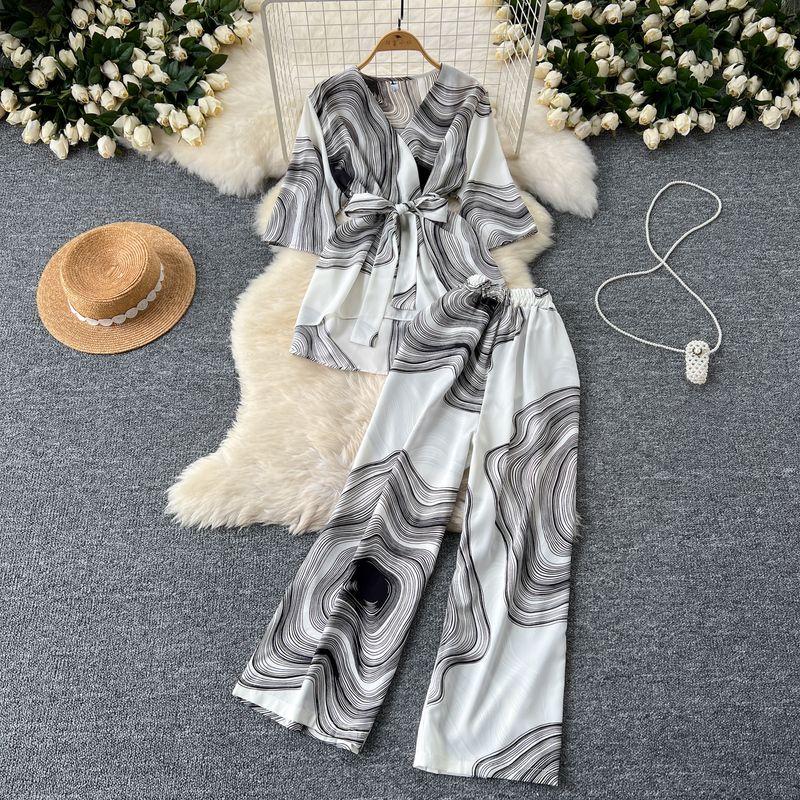 

Fashion Lightly Mature Younger Cinched Lace-up Half Sleeve Print Tops + High Waist Loose Wide-Leg Casual Pants Pants White All yards