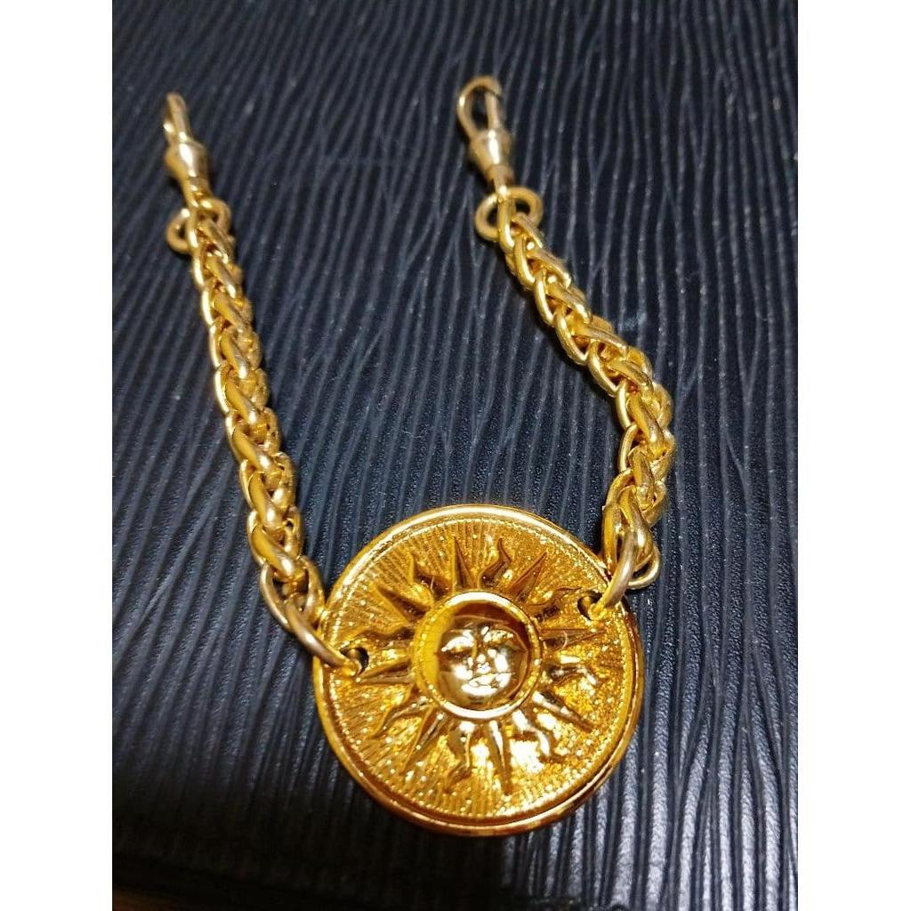 Used Golden Charm with Sun Motif