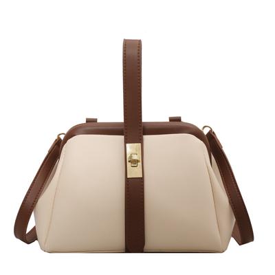 Die Color-Blocking-Handtasche ist modisch und retro mit einem Verschluss.. Es hat eine hochwertige Textur, ist stilvoll und vielseitig und ist eine Umhängetasche.