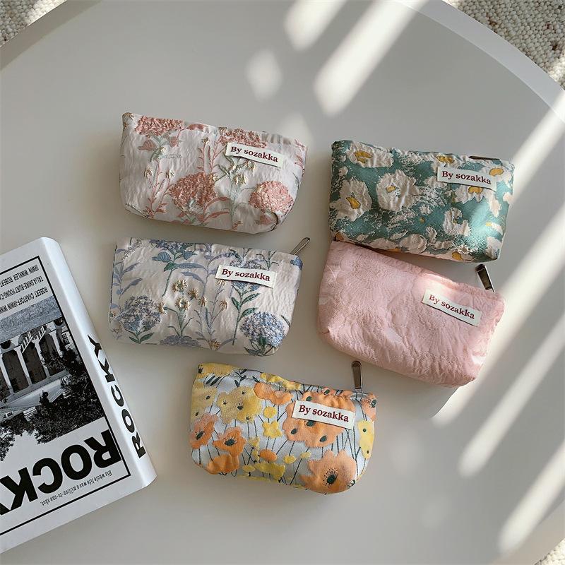 Trendy Ladies Simple And Portable Floral Embossed Cosmetic Bag For Use Everyday