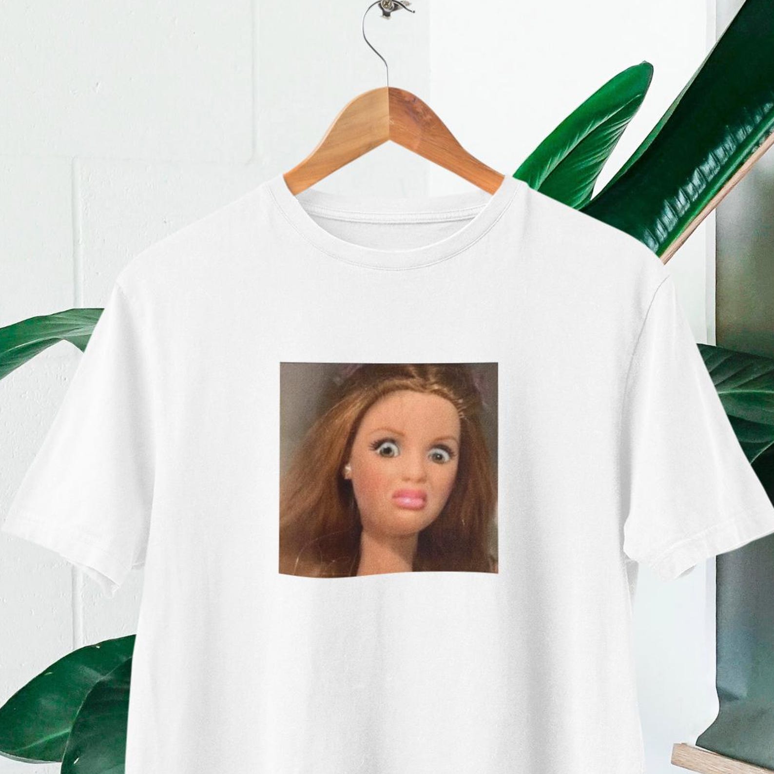 Funny Doll Face Meme T-Shirt | Shocked Expression, Viral Humor L