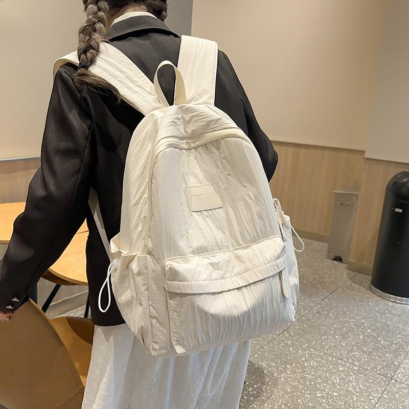 Fashion travel lightweight middle school college students class solid color backpack 2025 new simple niche design school bag