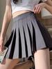 Korean-Style JK Pleated Skirt: Short, Versatile Student Skirt with Safety Pants, Zipper, and Buttons.