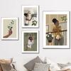 Abstract African Black Girl Swing Hand Flower Minimalist Wall Art Canvas Painting Posters for Living Room Modern Home Decor