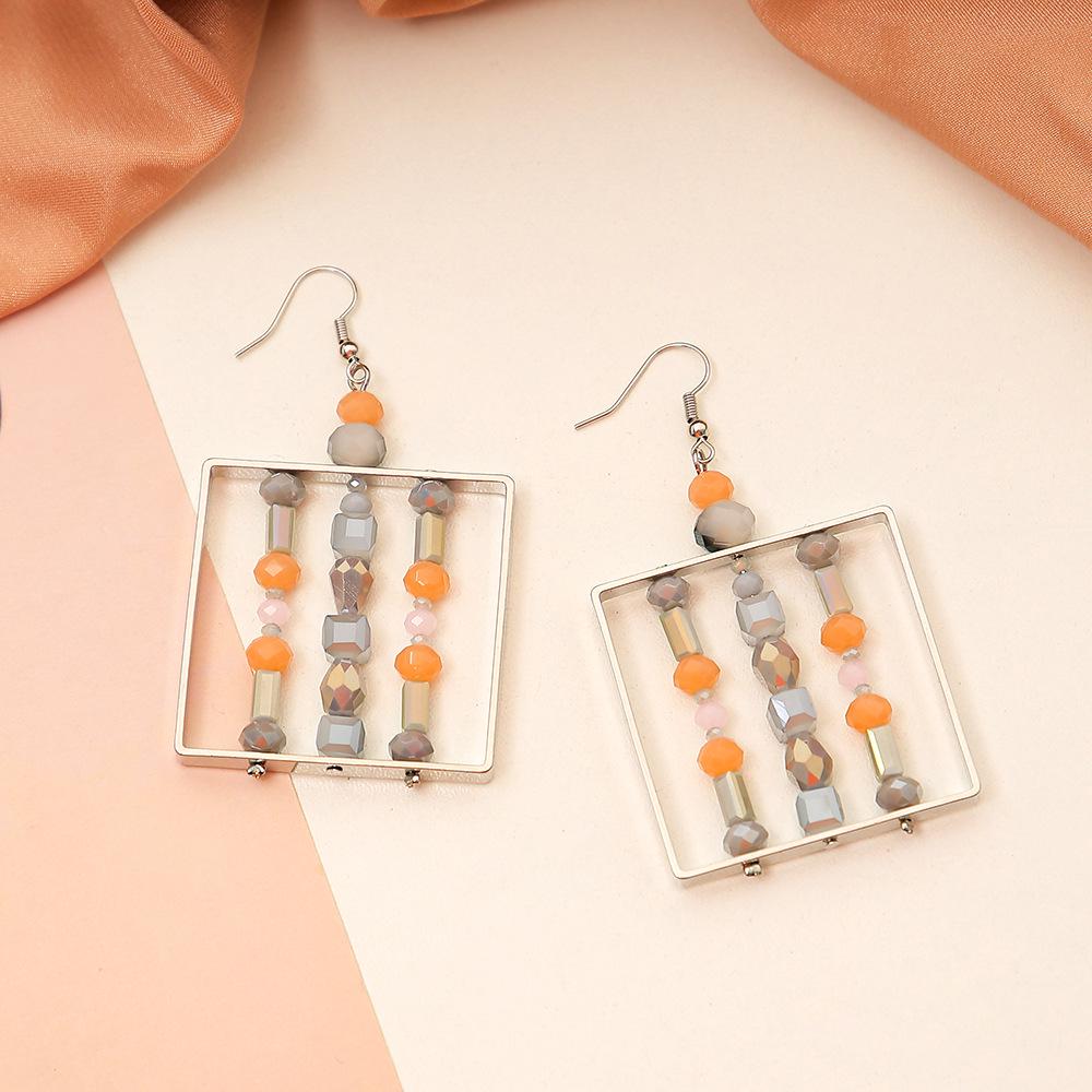 

Handmade Color Block Glass Bead Earrings: Luxurious, Exaggerated Square Design with a Hollow, Fashionable Twist.