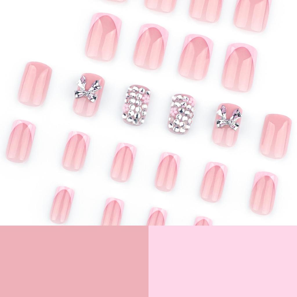 Short Square French Pink False Nails with 3D Metal Bow and Glitter Sparkle Nail Art.
