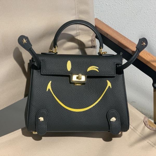 New Genuine Leather Women's Bag Head Layer Leather TOGO Leather Shattered Dimension Cartoon Graffiti Smiling Face Doll Women's Bag