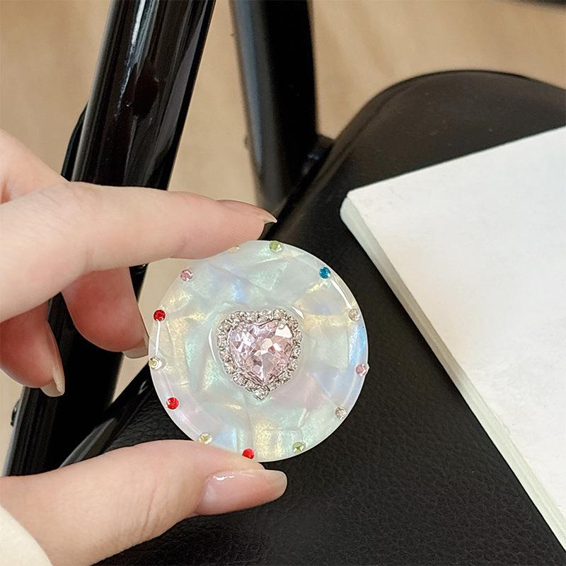 

Magnetic Retractable Phone Holder: Gemstone Ring & Airbag Stand for Lazy Desktop Viewing