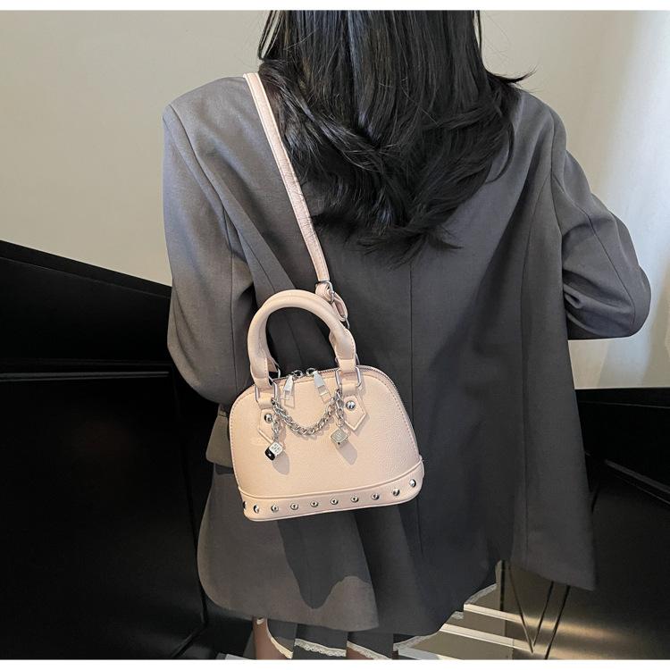 Popular portable shell small bag women's 2025 new high-end rivet saddle bag fashionable shoulder messenger bag